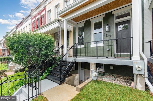 407 16th St SE, Washington, DC 20003 - view of exterior entry featuring a porch and brick siding