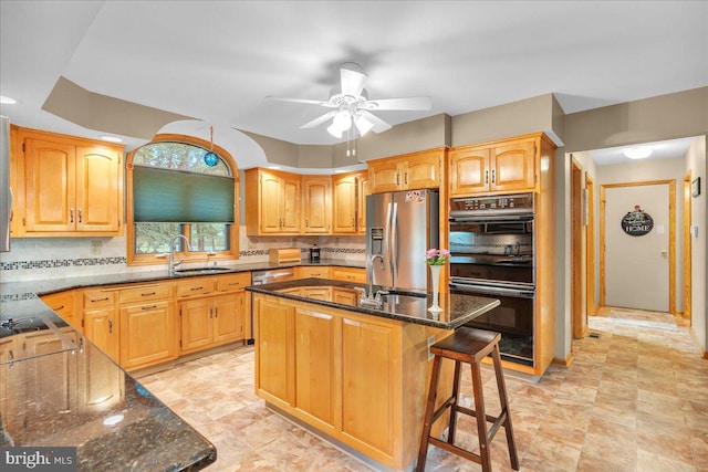 8 Winchester Ct, Tabernacle, NJ 08088 - kitchen with stainless steel appliances, a sink, dark stone counters, and ceiling fan