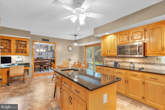 8 Winchester Ct, Tabernacle, NJ 08088 - kitchen featuring stainless steel microwave, dark stone countertops, black electric cooktop, a sink, and an island with sink