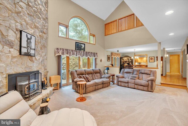 8 Winchester Ct, Tabernacle, NJ 08088 - carpeted living room featuring high vaulted ceiling, a chandelier, and a fireplace