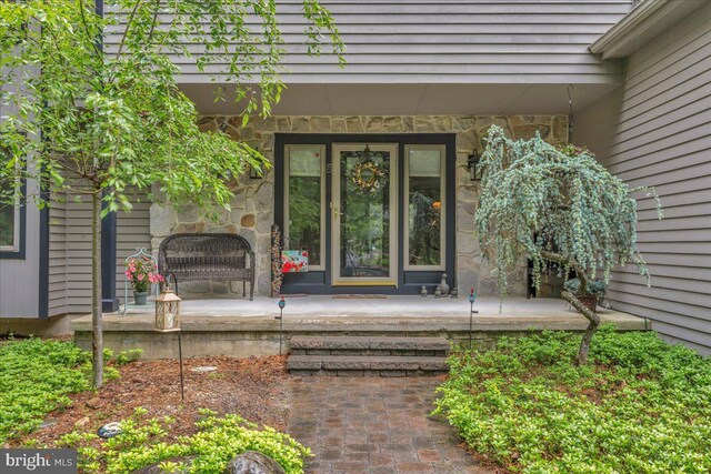 8 Winchester Ct, Tabernacle, NJ 08088 - doorway to property featuring stone siding and a porch