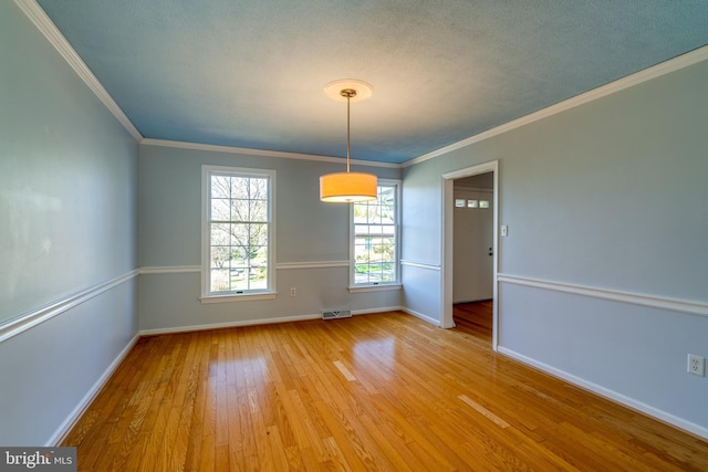 1114 Colonial Rd, Lancaster, PA 17603 - spare room with crown molding, baseboards, light wood-style flooring, and visible vents