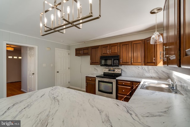 1114 Colonial Rd, Lancaster, PA 17603 - kitchen with brown cabinetry, ornamental molding, electric range, black microwave, and a sink