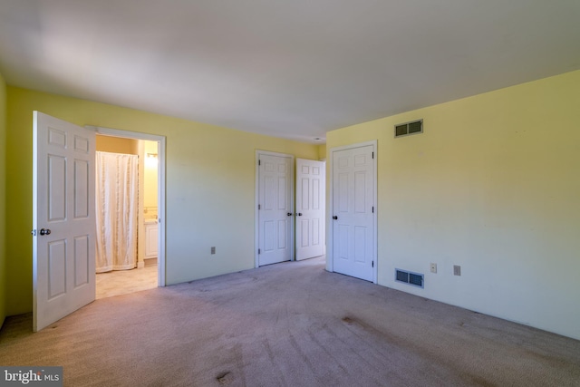 1114 Colonial Rd, Lancaster, PA 17603 - unfurnished bedroom featuring visible vents, carpet, and ensuite bath