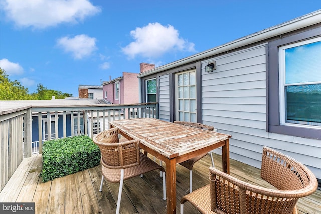 wooden deck with outdoor dining space