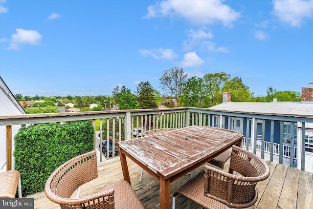 deck with outdoor dining area