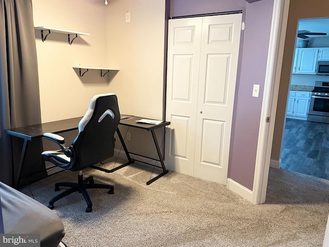 office featuring carpet floors and baseboards