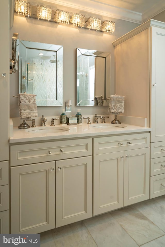 bathroom with crown molding, double vanity, walk in shower, and a sink