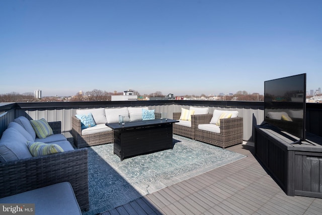 wooden deck with an outdoor living space