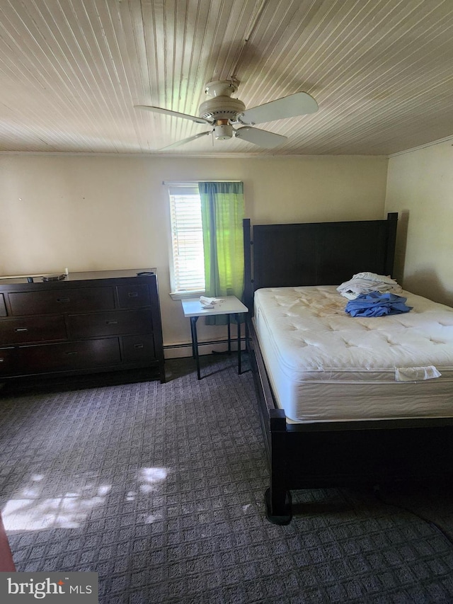 bedroom with a ceiling fan, carpet, a baseboard radiator, and wooden ceiling