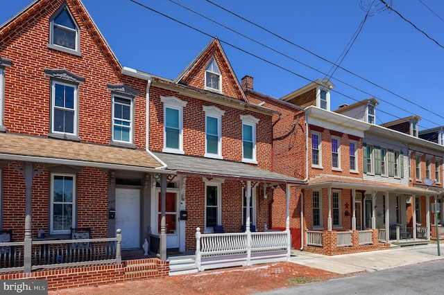 731 Locust St, Columbia, PA 17512 - townhome / multi-family property with covered porch and brick siding