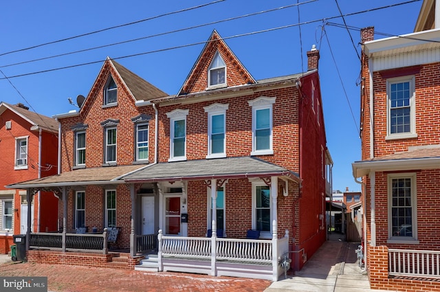 731 Locust St, Columbia, PA 17512 - view of front of home with a porch and brick siding