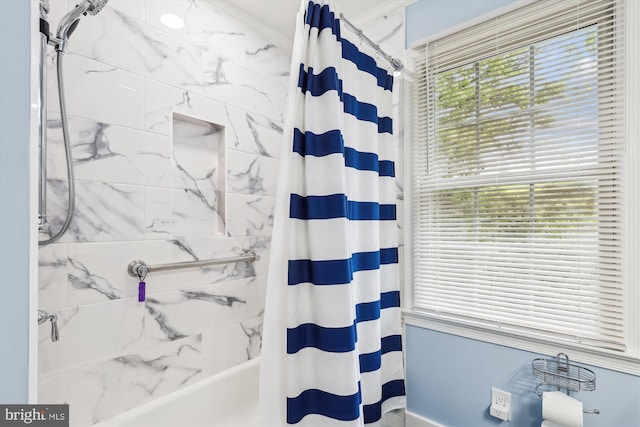full bathroom with shower / bath combination with curtain