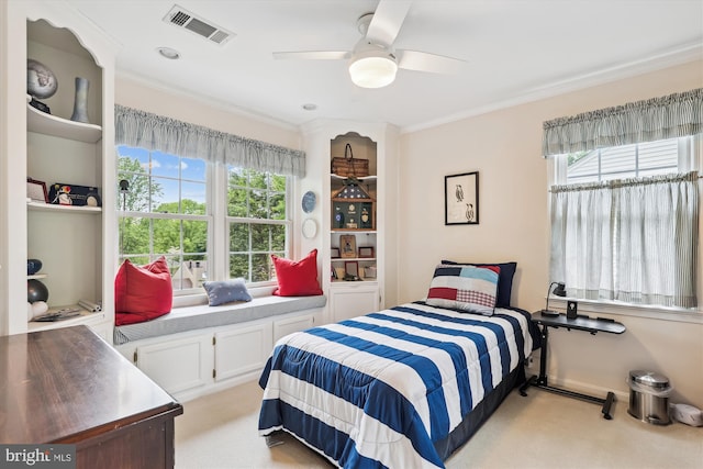 bedroom with light colored carpet, ceiling fan, visible vents, and ornamental molding