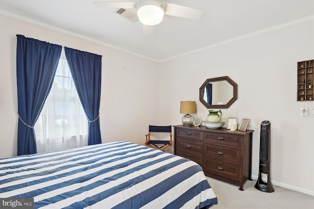 bedroom featuring baseboards, ornamental molding, light carpet, and visible vents