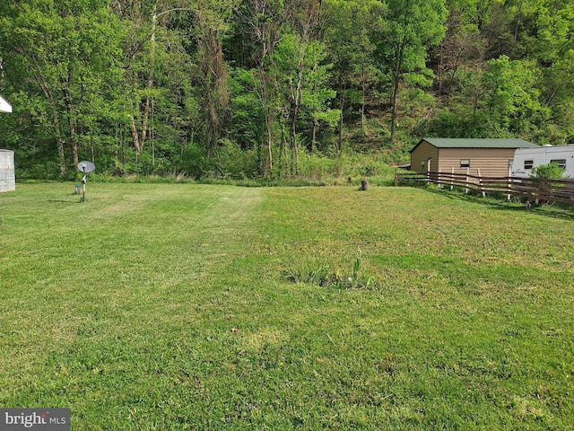 view of yard with a wooded view