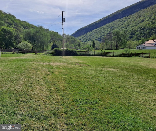 mountain view featuring a rural view