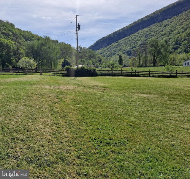 mountain view featuring a rural view