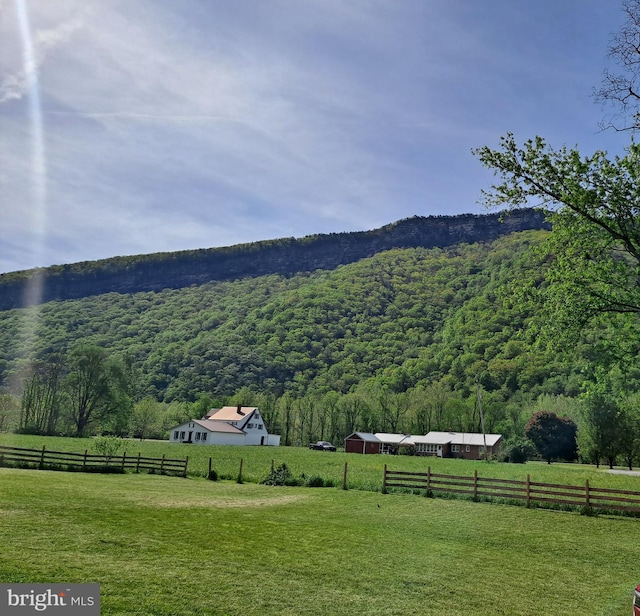 property view of mountains featuring a rural view and a wooded view