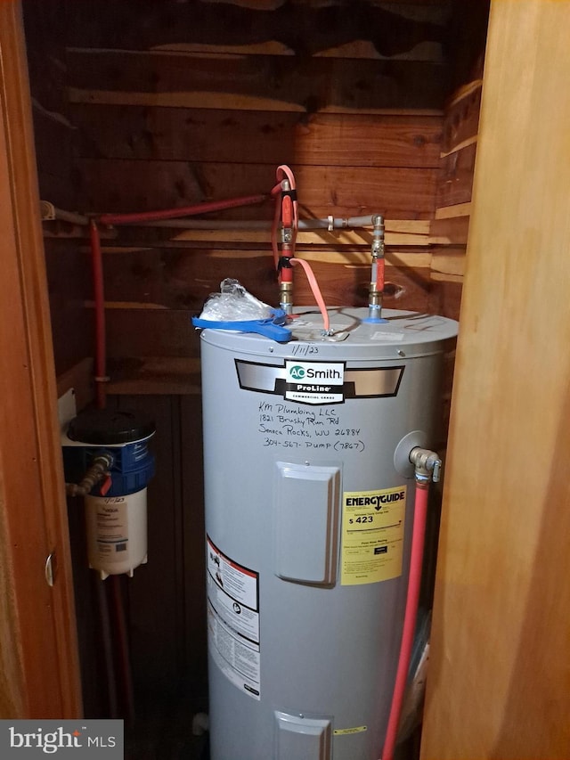 utility room with water heater