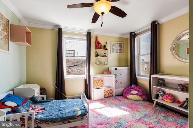 bedroom featuring crown molding, ceiling fan, and multiple windows