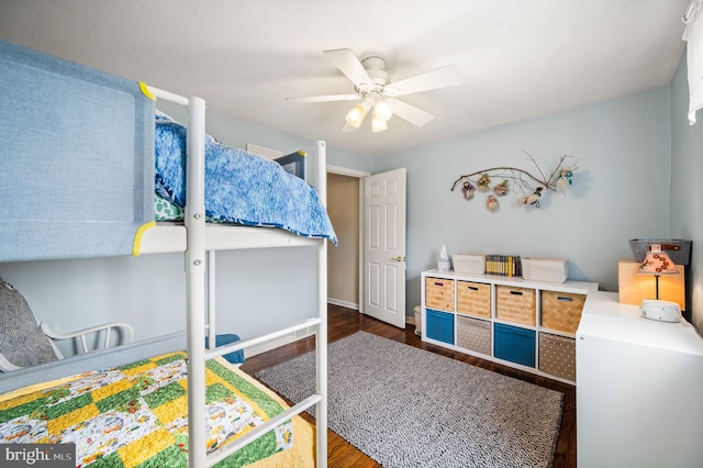 bedroom featuring a ceiling fan and wood finished floors