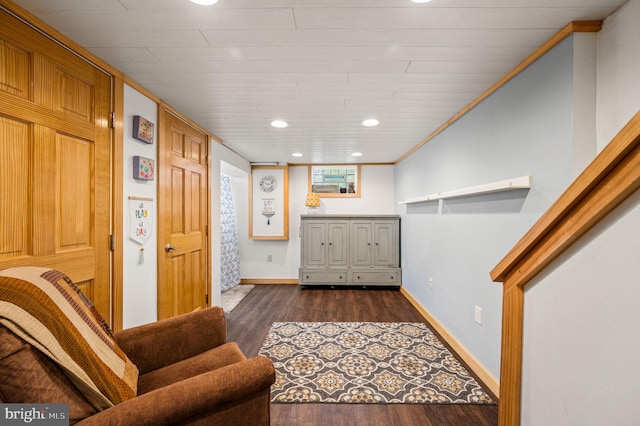 living area with recessed lighting, baseboards, and wood finished floors