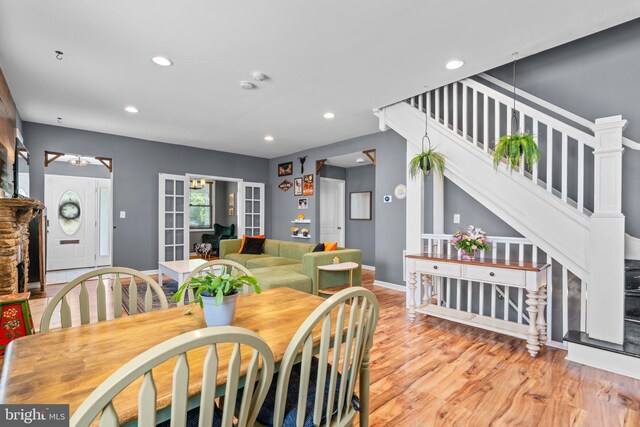 5310 Brabant Rd, Baltimore, MD 21229 - dining space featuring stairs, recessed lighting, wood finished floors, and baseboards