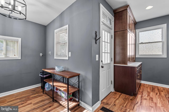 5310 Brabant Rd, Baltimore, MD 21229 - entryway with light wood-style floors, baseboards, a chandelier, and recessed lighting