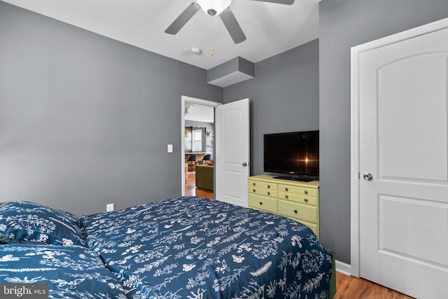bedroom featuring ceiling fan and wood finished floors