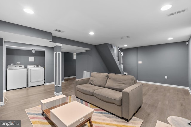 living area with baseboards and visible vents