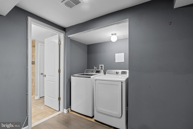 5310 Brabant Rd, Baltimore, MD 21229 - laundry area featuring independent washer and dryer