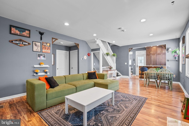 5310 Brabant Rd, Baltimore, MD 21229 - living area with light wood-style floors, baseboards, recessed lighting, and stairs