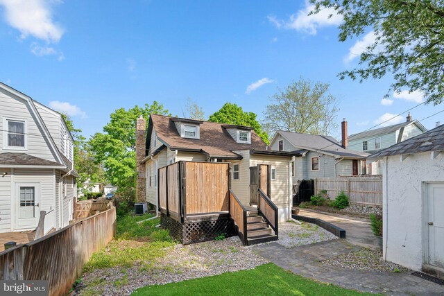 5310 Brabant Rd, Baltimore, MD 21229 - back of property with fence, a residential view, and central AC unit