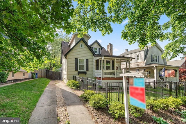 5310 Brabant Rd, Baltimore, MD 21229 - view of front of house with a chimney and a shingled roof