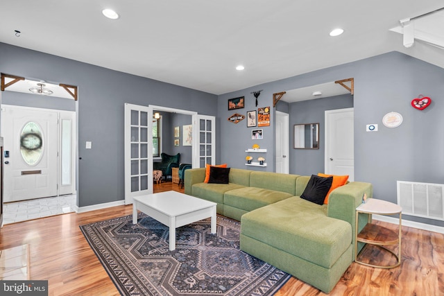 5310 Brabant Rd, Baltimore, MD 21229 - living area with french doors, wood finished floors, baseboards, and recessed lighting