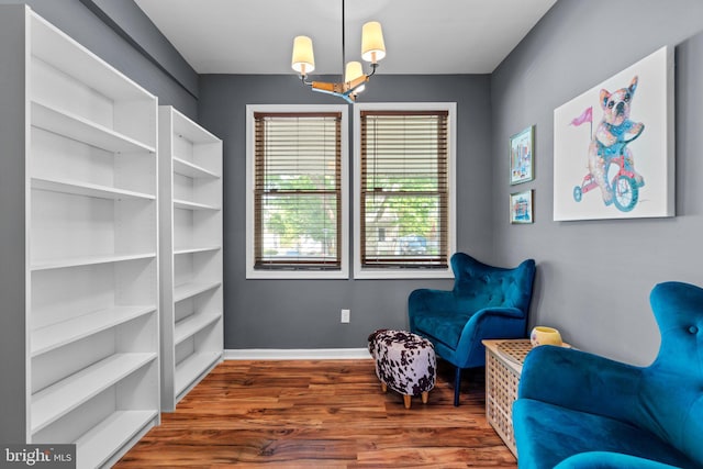 5310 Brabant Rd, Baltimore, MD 21229 - sitting room with a chandelier, wood finished floors, and baseboards