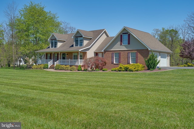 new england style home featuring brick siding, a front lawn, aphalt driveway, and covered porch
