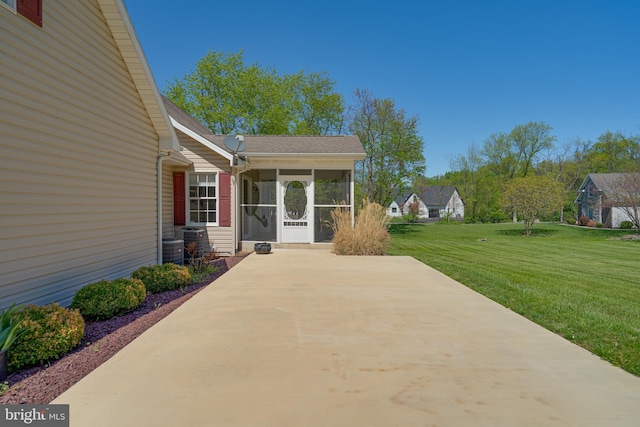 view of patio with central air condition unit and a sunroom