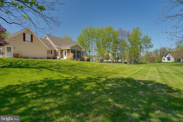 view of yard featuring a sunroom