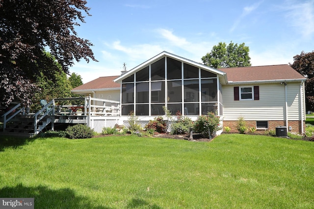 2426 Mount Pleasant Rd, Mount Joy, PA 17552 - back of property with a sunroom, a yard, a wooden deck, and central AC unit