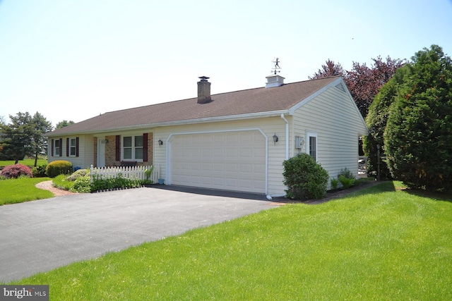 2426 Mount Pleasant Rd, Mount Joy, PA 17552 - ranch-style home with a garage, a front lawn, a chimney, and asphalt driveway