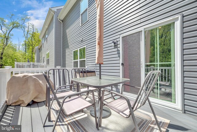 deck with outdoor dining space