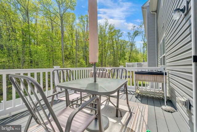 deck featuring outdoor dining area
