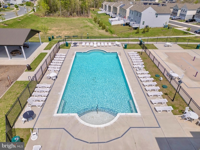 community pool featuring fence