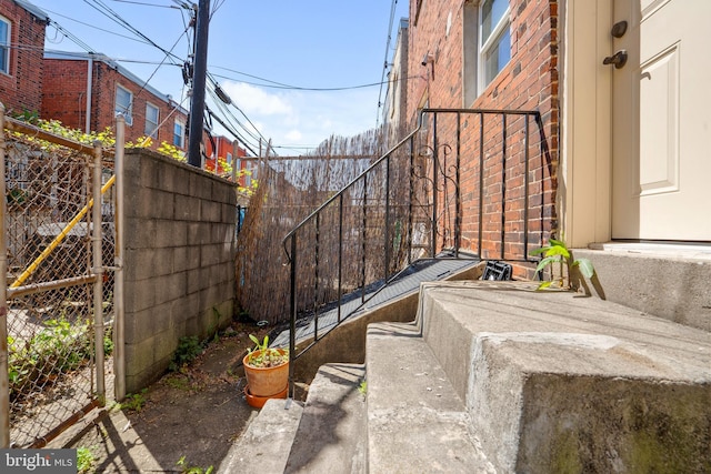 view of patio / terrace featuring fence