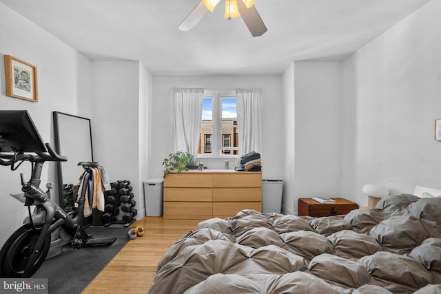 bedroom with a ceiling fan and wood finished floors