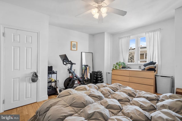 bedroom featuring a ceiling fan and light wood finished floors
