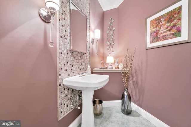bathroom featuring baseboards and tile patterned flooring