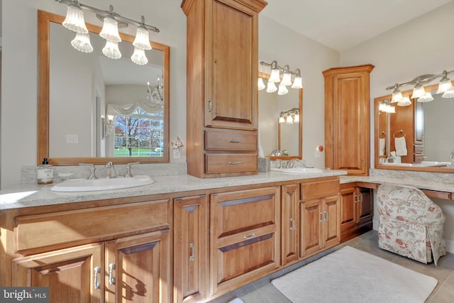 bathroom featuring a notable chandelier, a sink, and tile patterned flooring
